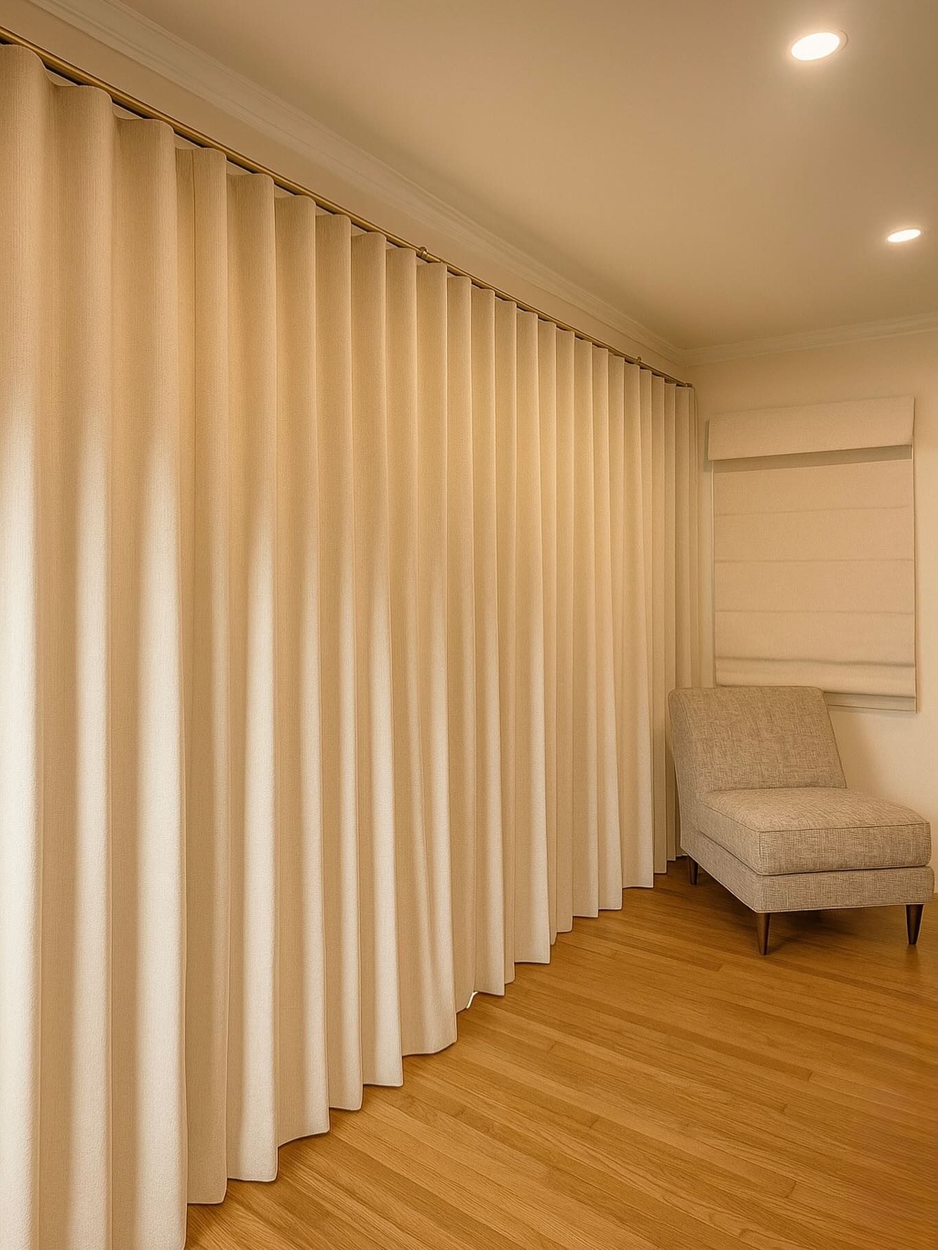 Ripplefold drapery on a ceiling-mounted track in a San Diego home, showing the continuous even S-curve