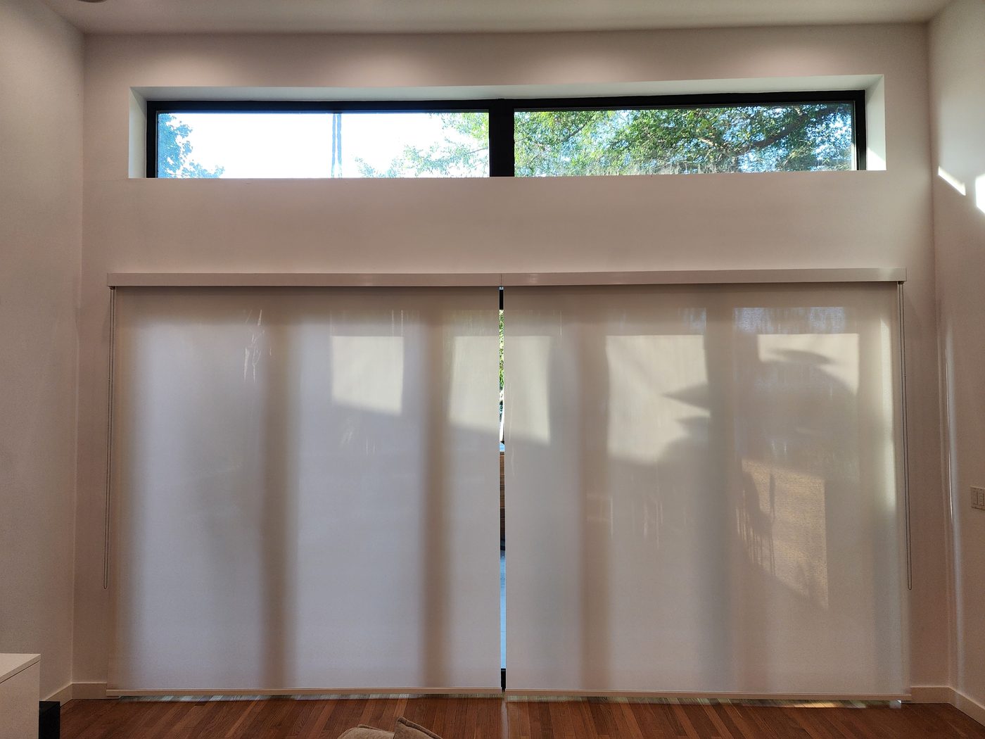 The same San Diego slider with motorized shades lowered