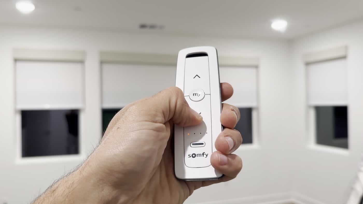 A Somfy remote controlling motorized roller shades