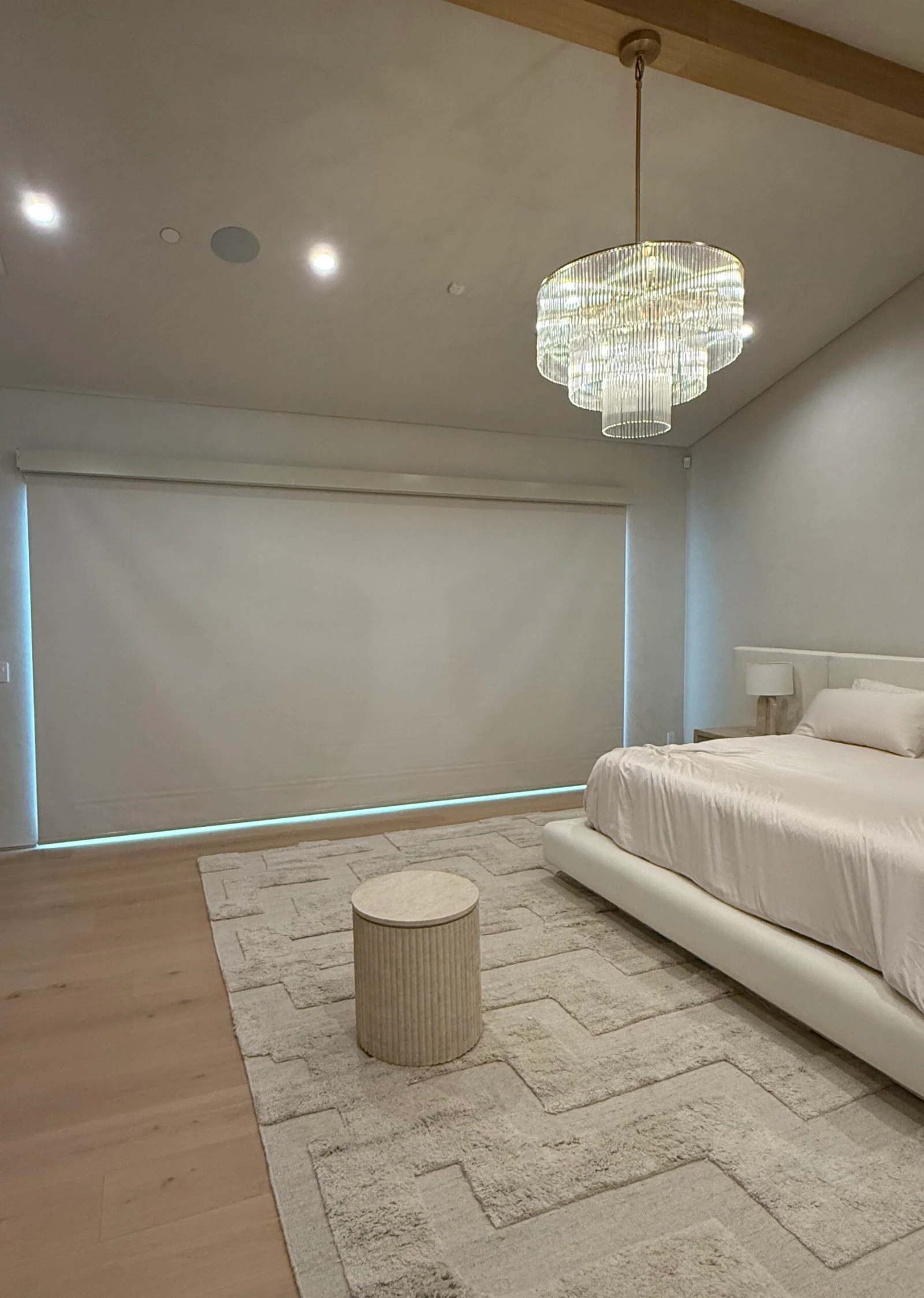 Bedroom with motorized blackout roller shades